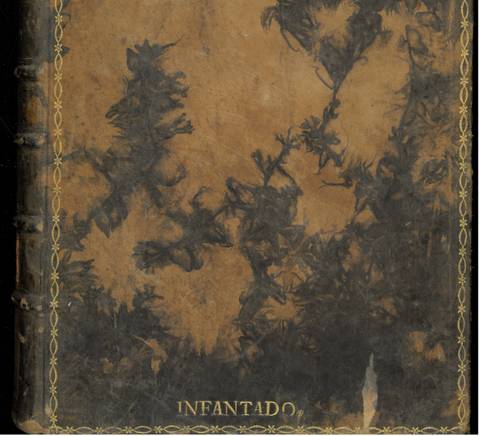 Un libro antiguo con una cubierta de cuero desgastada y decoraciones en dorado.