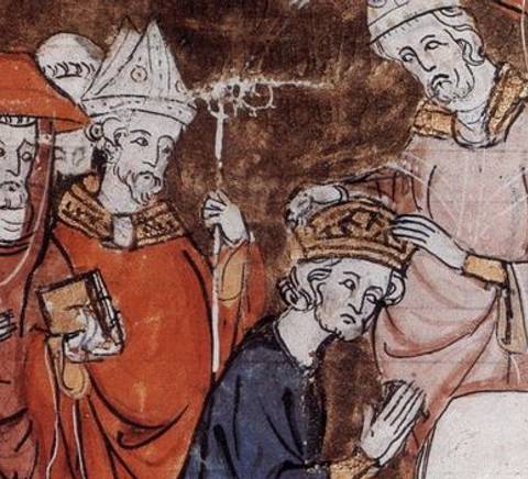 La imagen muestra una escena de coronación de un monarca, rodeado de figuras religiosas y nobles en vestiduras medievales.