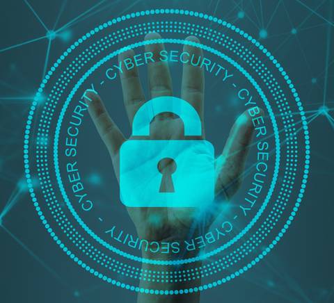 La imagen representa un símbolo de ciberseguridad con una mano y un candado en un fondo digital.