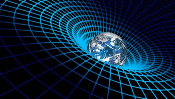 Una representación visual del fenómeno de la gravitación donde la Tierra se encuentra en un espacio deformado por la gravedad.