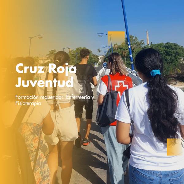 A group of young people walking outdoors, with one person wearing a Red Cross volunteer vest.