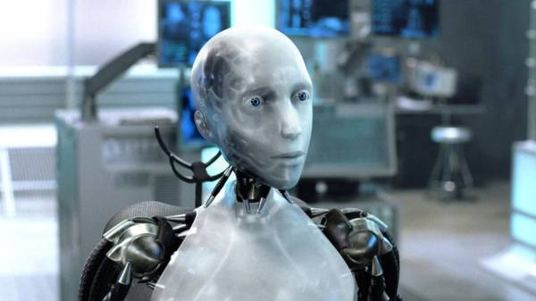 Un robot humanoide con apariencia metálica y ojos azules en un entorno de alta tecnología.