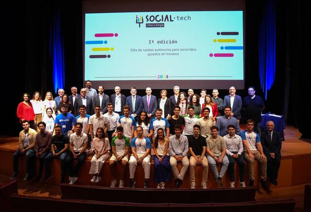 A group of people posing for a photo at a Social-tech event.
