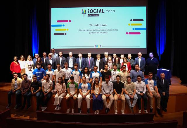 A group of people posing for a photo at a Social-tech event.