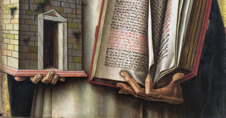 La imagen muestra a Santo Tomás de Aquino sosteniendo un libro y un modelo de iglesia.