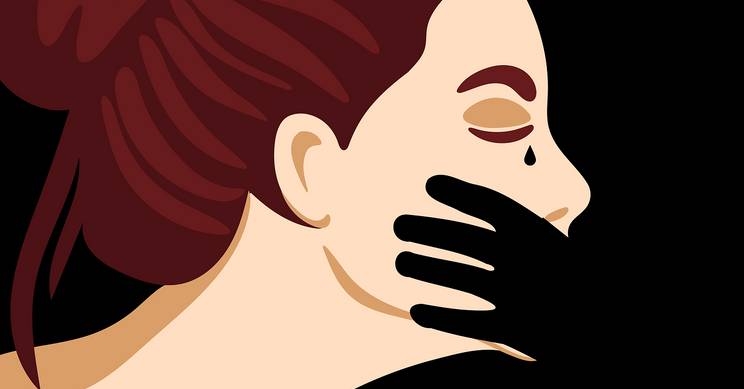 Una ilustración que muestra el perfil de una mujer con una expresión de tristeza.