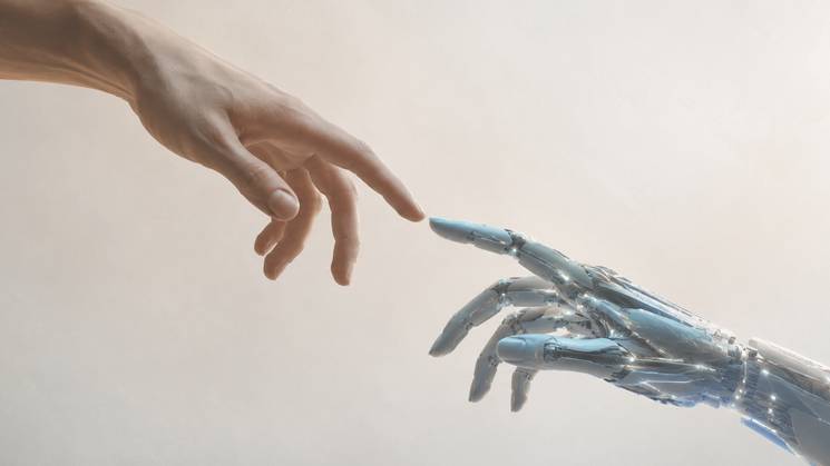 Una mano humana y una mano robótica se acercan a punto de tocarse.