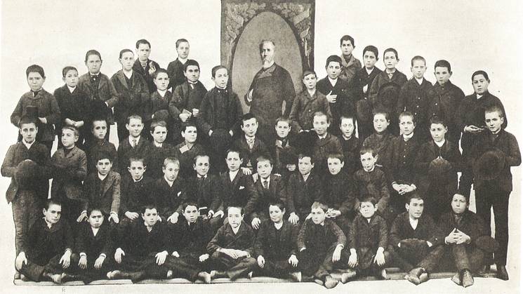 Black and white photo of a group of seminary students with a priest, taken in January 1892.