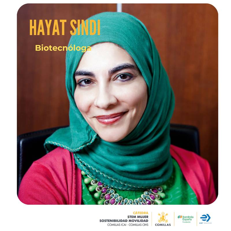 La imagen muestra a Hayat Sindi, una destacada biotecnóloga vestida con un atuendo colorido y un pañuelo verde.