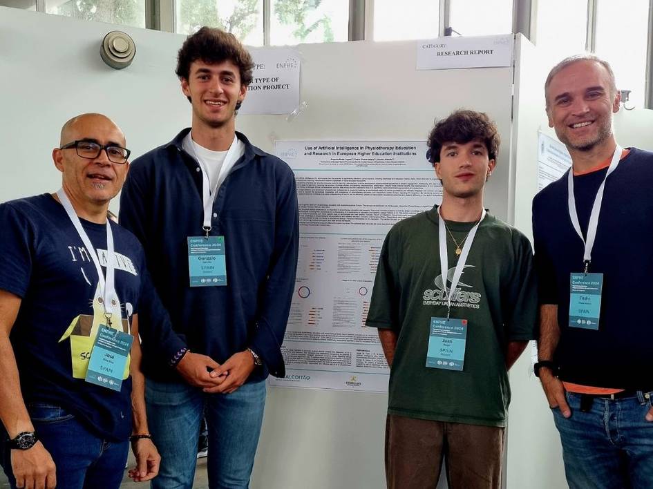 Four men standing in front of a science poster at a conference.