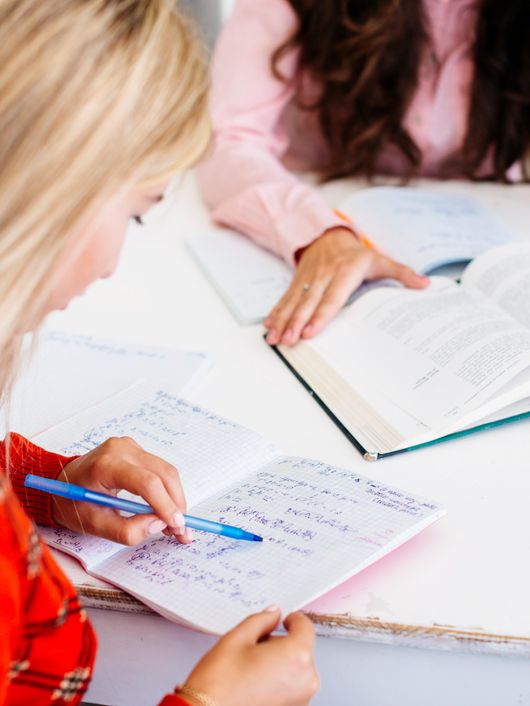 students-completing-homework-table.jpeg