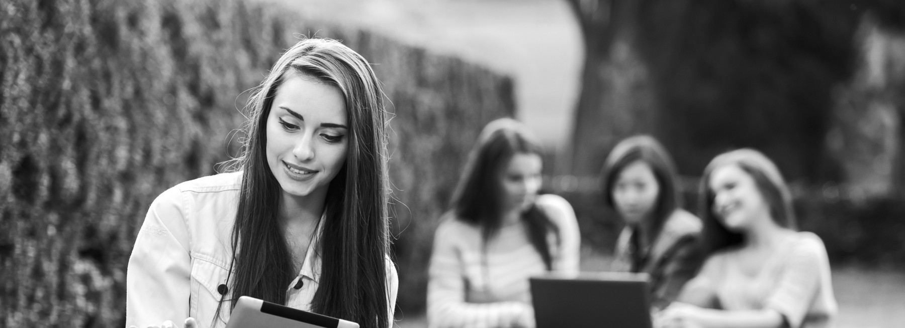 smiling-college-girl-is-holding-tablet-pc 1 (1).png