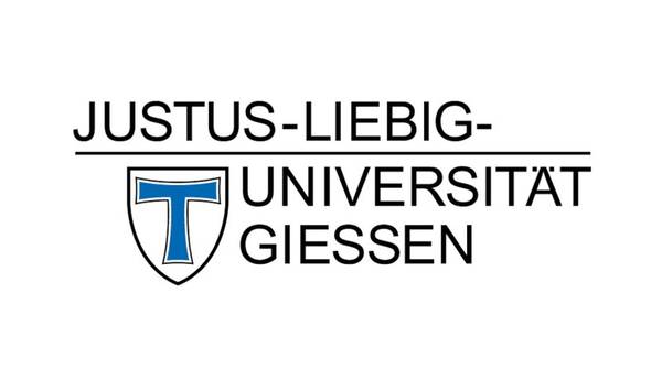 Logotipo de la Universidad Justus Liebig de Giessen, mostrando el nombre de la universidad y un escudo con la letra T.